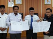 Pemkab Bersama KPU dan Bawaslu OKI Tandatangani NPHD Pemilu